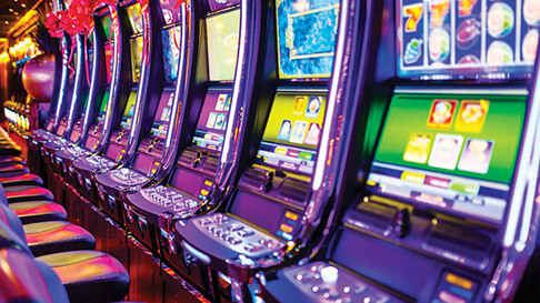 A row of electronic slot machines.
